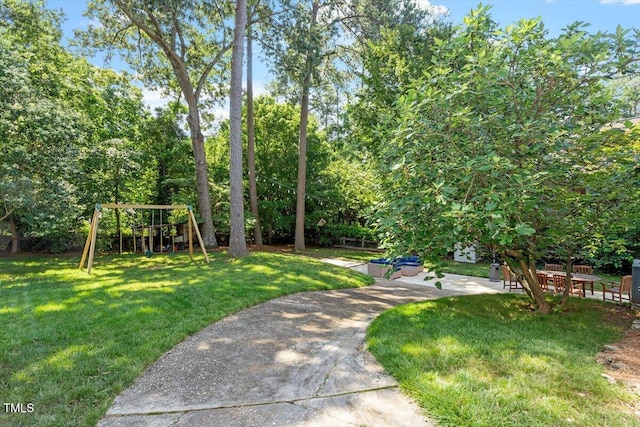 1100 Brooks Ave, Raleigh, NC 27607 - view of green lawn with a playground and a patio