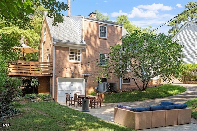 1100 Brooks Ave, Raleigh, NC 27607 - back of house featuring brick siding, an attached garage, outdoor lounge area, and a chimney