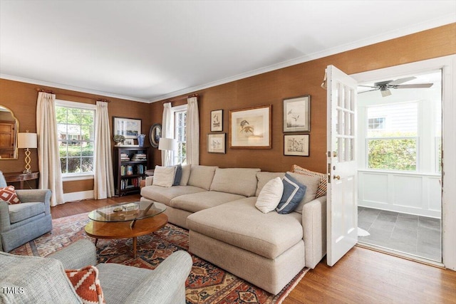 1100 Brooks Ave, Raleigh, NC 27607 - living area featuring wood finished floors, a ceiling fan, and ornamental molding