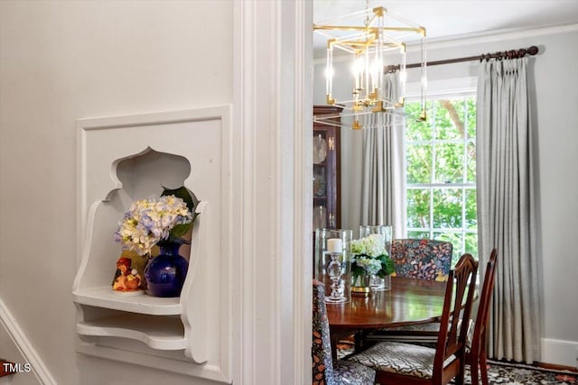 1100 Brooks Ave, Raleigh, NC 27607 - dining room with a chandelier and baseboards
