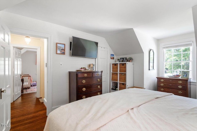 1100 Brooks Ave, Raleigh, NC 27607 - bedroom with vaulted ceiling and wood finished floors