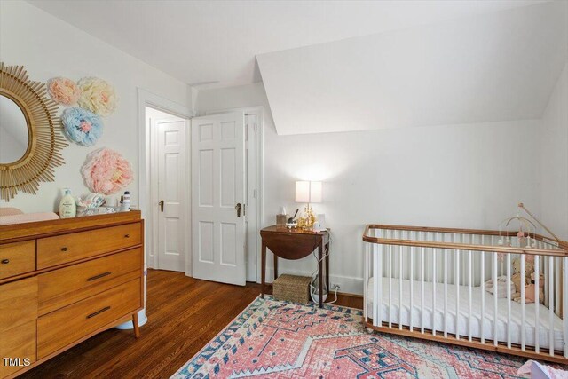 1100 Brooks Ave, Raleigh, NC 27607 - bedroom featuring wood finished floors and a nursery area