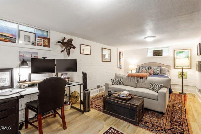 1100 Brooks Ave, Raleigh, NC 27607 - bedroom with wood finished floors, a textured ceiling, and an office area