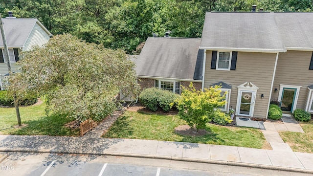 2213 Alpine Rd, Durham, NC 27707 - view of front of house featuring uncovered parking, a front lawn, and a shingled roof