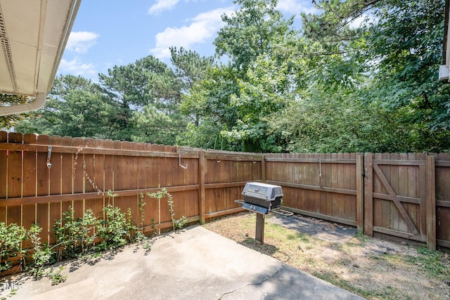 2213 Alpine Rd, Durham, NC 27707 - fenced backyard featuring a patio area, grilling area, and a gate