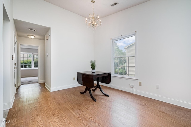 2213 Alpine Rd, Durham, NC 27707 - dining room featuring a chandelier, light wood finished floors, and a desk