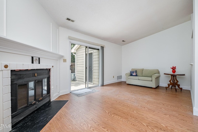 2213 Alpine Rd, Durham, NC 27707 - living area featuring a fireplace and light wood-type flooring