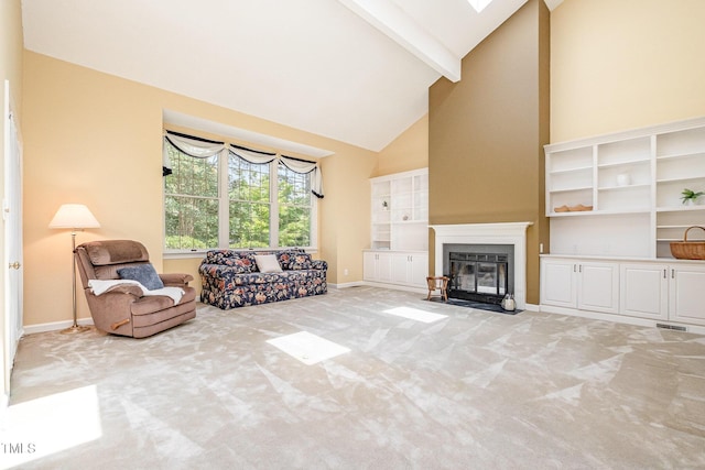 384 Lyndfield Cl W, Pittsboro, NC 27312 - living room with high vaulted ceiling, light carpet, beam ceiling, and a fireplace with flush hearth