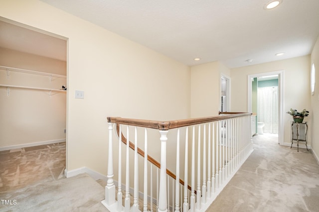 384 Lyndfield Cl W, Pittsboro, NC 27312 - hall with carpet floors, an upstairs landing, and recessed lighting