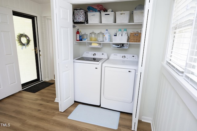 2320 Marks Creek Rd, Knightdale, NC 27545 - laundry area with independent washer and dryer, wood finished floors, and healthy amount of natural light