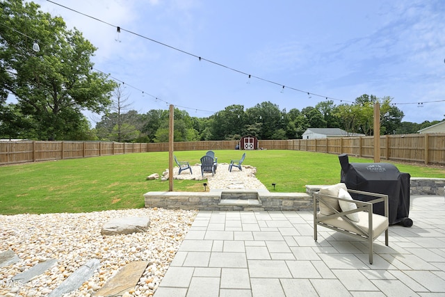 2320 Marks Creek Rd, Knightdale, NC 27545 - fenced backyard with a patio area, a storage shed, area for grilling, and an outdoor fire pit