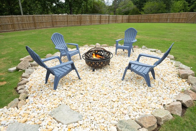 2320 Marks Creek Rd, Knightdale, NC 27545 - fenced backyard with an outdoor fire pit