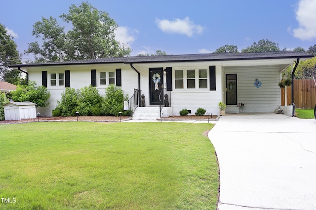 2320 Marks Creek Rd, Knightdale, NC 27545 - ranch-style house with driveway, a shed, an attached carport, and brick siding