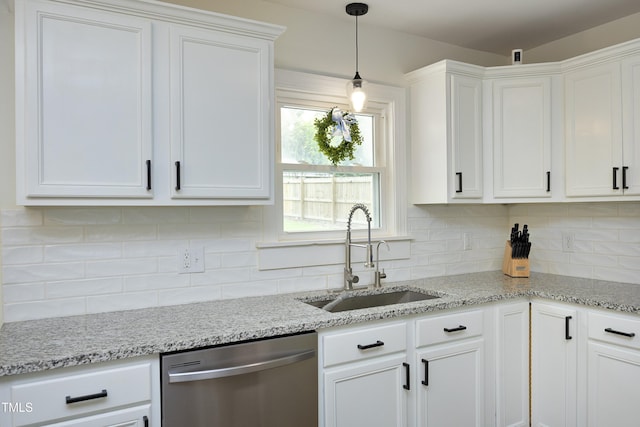 2320 Marks Creek Rd, Knightdale, NC 27545 - kitchen with stainless steel dishwasher, white cabinets, backsplash, and hanging light fixtures