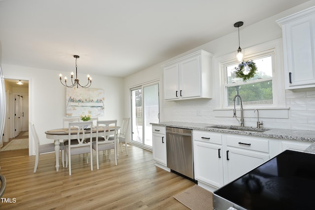 2320 Marks Creek Rd, Knightdale, NC 27545 - kitchen with dishwasher, plenty of natural light, backsplash, and white cabinetry
