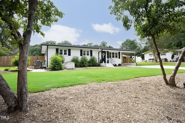 2320 Marks Creek Rd, Knightdale, NC 27545 - rear view of house featuring driveway and an attached carport