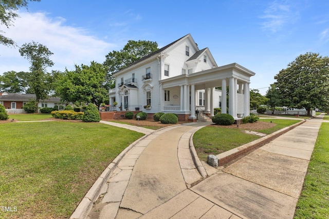 309 W Divine St, Dunn, NC 28334 - view of front of home with covered porch and a front yard
