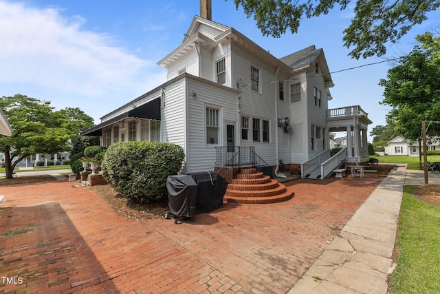 309 W Divine St, Dunn, NC 28334 - view of home's exterior with a balcony