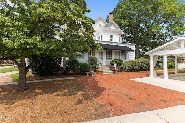 309 W Divine St, Dunn, NC 28334 - view of front of house featuring a chimney and a gazebo