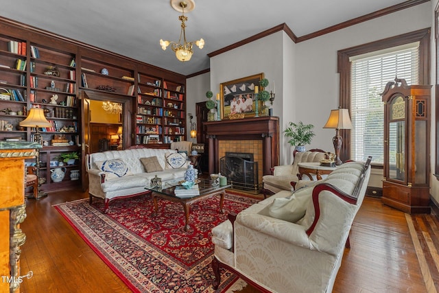 309 W Divine St, Dunn, NC 28334 - living area featuring a chandelier, crown molding, hardwood / wood-style floors, and a tile fireplace