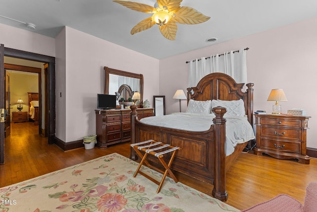 309 W Divine St, Dunn, NC 28334 - bedroom featuring wood finished floors and a ceiling fan