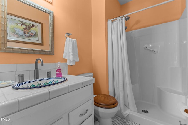 309 W Divine St, Dunn, NC 28334 - bathroom featuring vanity, a shower with shower curtain, and tile patterned floors