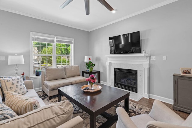200 Holly Branch Dr, Holly Springs, NC 27540 - living room featuring wood finished floors, a fireplace, ornamental molding, and a ceiling fan