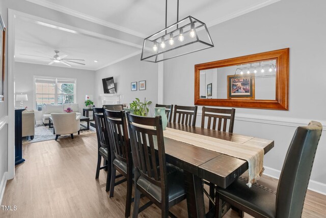200 Holly Branch Dr, Holly Springs, NC 27540 - dining room with wood finished floors, ceiling fan, and ornamental molding