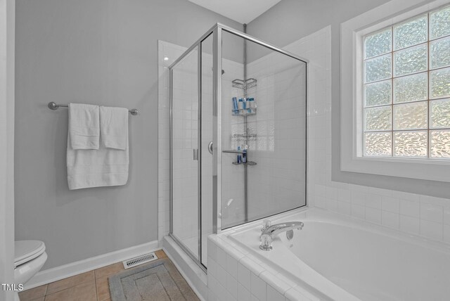 200 Holly Branch Dr, Holly Springs, NC 27540 - full bath featuring a bath, a shower stall, and tile patterned floors