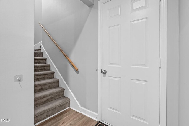 200 Holly Branch Dr, Holly Springs, NC 27540 - staircase with wood finished floors and baseboards