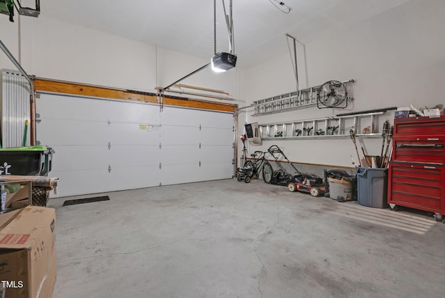 200 Holly Branch Dr, Holly Springs, NC 27540 - garage featuring a garage door opener