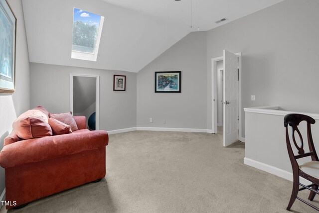 200 Holly Branch Dr, Holly Springs, NC 27540 - living area with vaulted ceiling, light colored carpet, a skylight, healthy amount of natural light, and ceiling fan