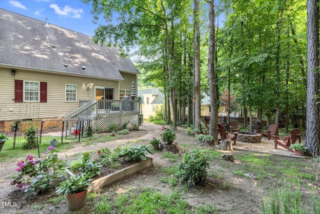 200 Holly Branch Dr, Holly Springs, NC 27540 - view of yard featuring a fire pit, a deck, and a vegetable garden