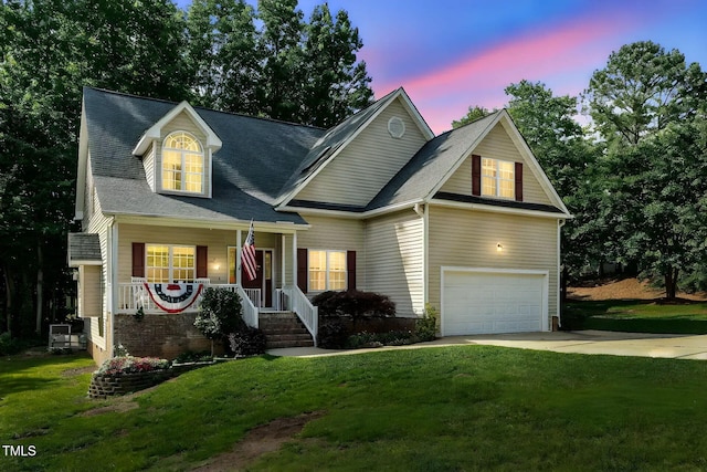 200 Holly Branch Dr, Holly Springs, NC 27540 - traditional-style home featuring a porch, a garage, driveway, and a front lawn