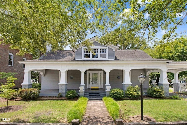 125 W Pine St, Pine Level, NC 27568 - view of front of home featuring covered porch and a front yard