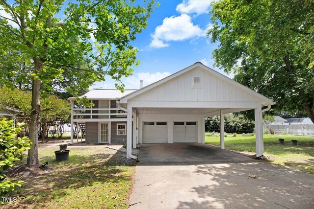 125 W Pine St, Pine Level, NC 27568 - view of front of home featuring driveway, stairway, and a garage