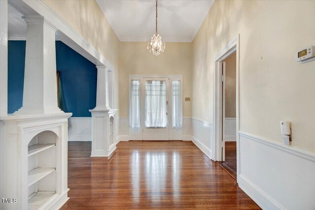 125 W Pine St, Pine Level, NC 27568 - foyer entrance featuring wood finished floors, a chandelier, and wainscoting