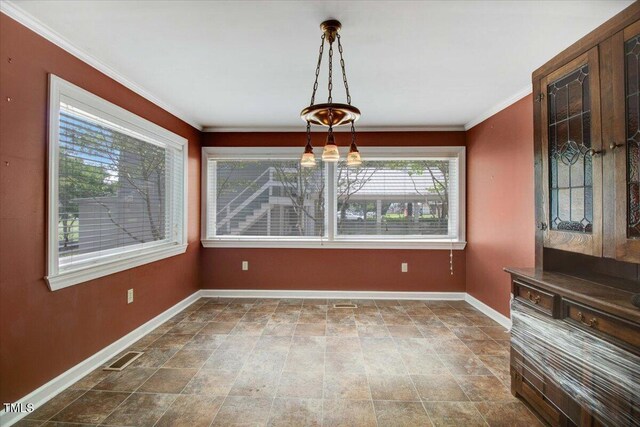 125 W Pine St, Pine Level, NC 27568 - unfurnished dining area with baseboards and crown molding