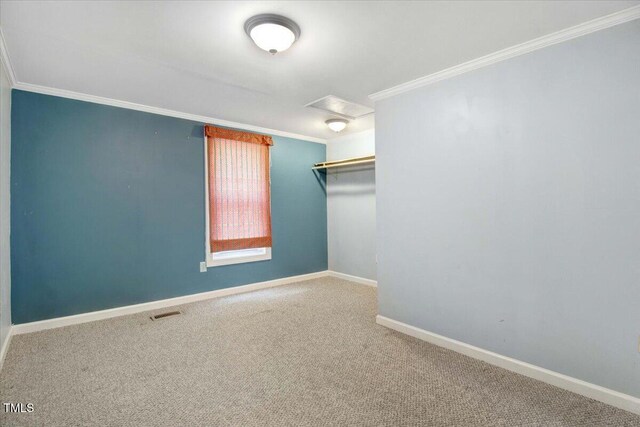 125 W Pine St, Pine Level, NC 27568 - unfurnished room with attic access, crown molding, carpet flooring, and baseboards