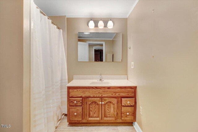 125 W Pine St, Pine Level, NC 27568 - bathroom featuring vanity, crown molding, and baseboards