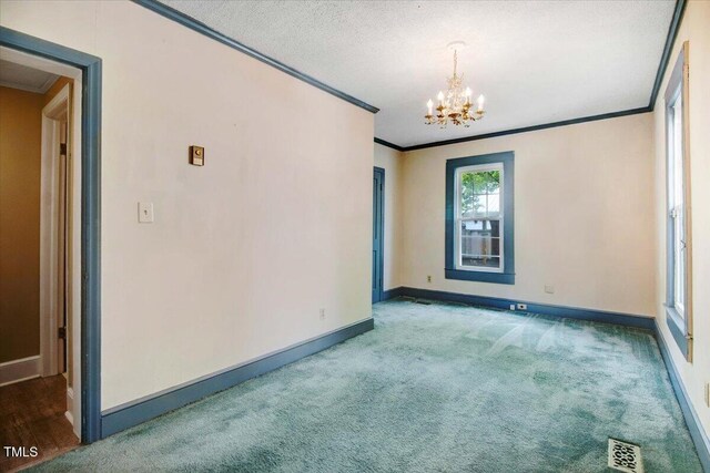 125 W Pine St, Pine Level, NC 27568 - carpeted empty room featuring crown molding, a chandelier, and baseboards