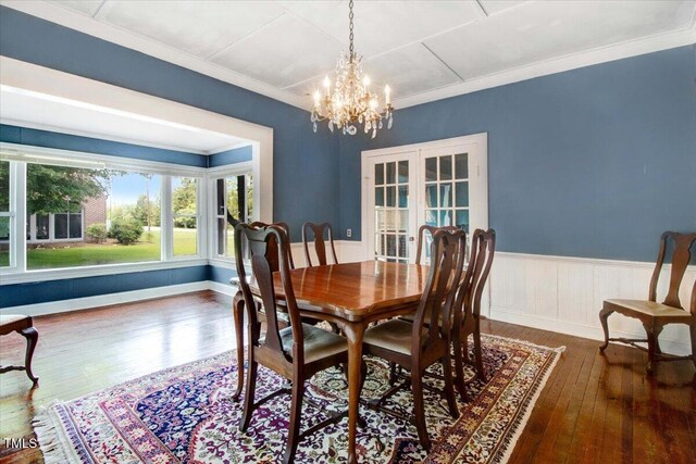 125 W Pine St, Pine Level, NC 27568 - dining area featuring wood-type flooring, french doors, a chandelier, crown molding, and wainscoting