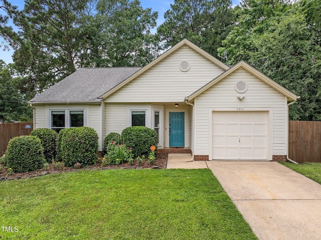 5801 Hadrian Dr, Durham, NC 27703 - view of front facade with a garage, concrete driveway, and a shingled roof