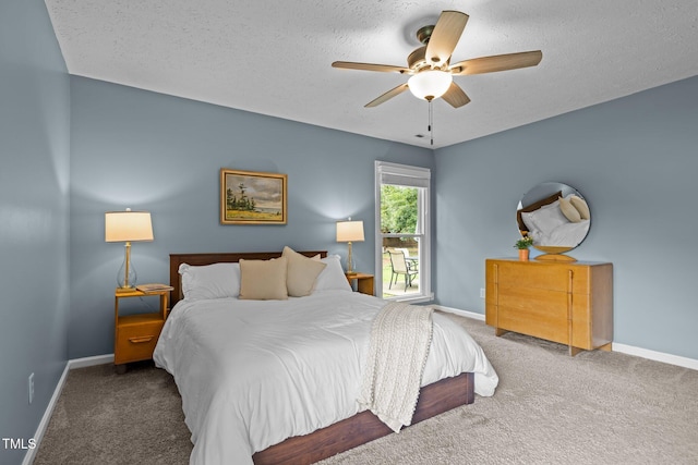 5801 Hadrian Dr, Durham, NC 27703 - bedroom featuring carpet flooring, a textured ceiling, and ceiling fan
