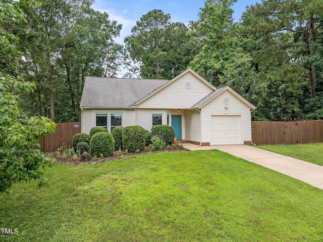 5801 Hadrian Dr, Durham, NC 27703 - view of front of property with an attached garage, driveway, and roof with shingles