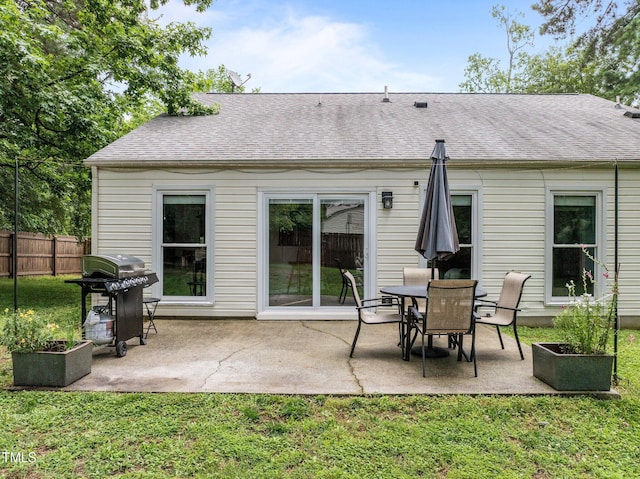 5801 Hadrian Dr, Durham, NC 27703 - back of property with a patio and roof with shingles