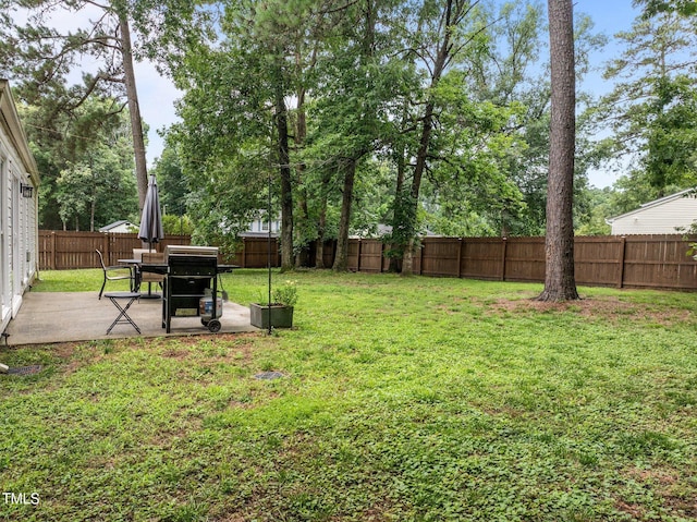 5801 Hadrian Dr, Durham, NC 27703 - fenced backyard featuring a patio