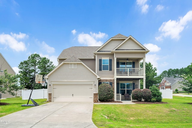 5637 Garnet Meadow Rd, Knightdale, NC 27545 - view of front facade with a balcony, a ceiling fan, driveway, an attached garage, and a shingled roof