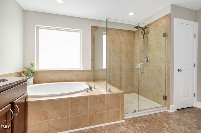 5637 Garnet Meadow Rd, Knightdale, NC 27545 - bathroom featuring a garden tub, a stall shower, vanity, and recessed lighting