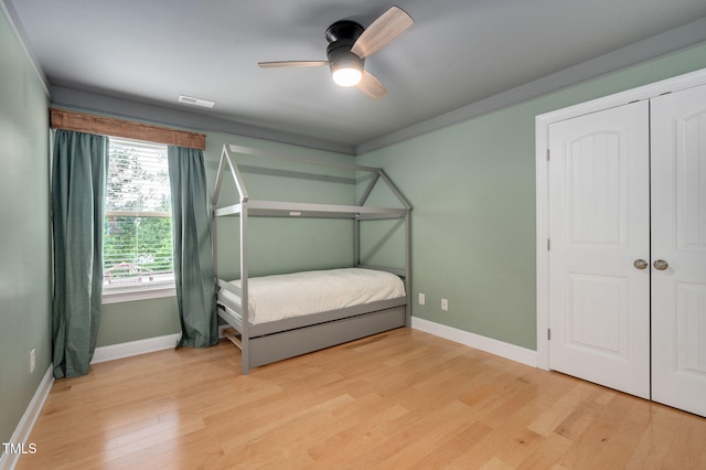 5637 Garnet Meadow Rd, Knightdale, NC 27545 - bedroom featuring light wood finished floors, ceiling fan, and a closet